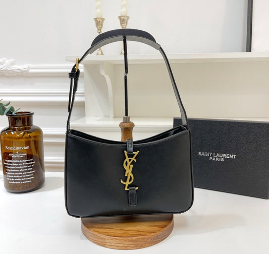 Saint laurent hobo bag with an adjustable strap and closure with metal ysl hook