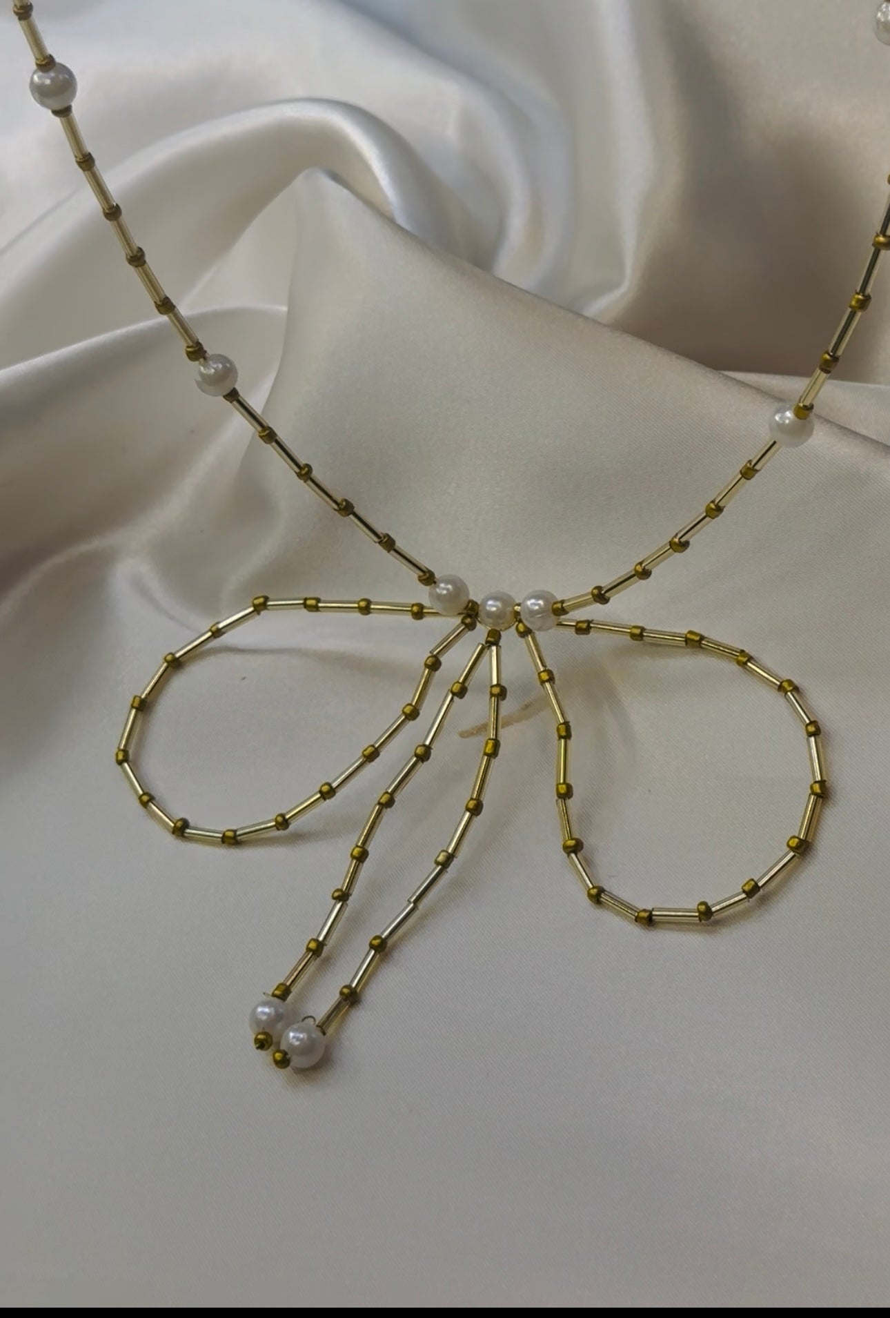 Gold beaded bow