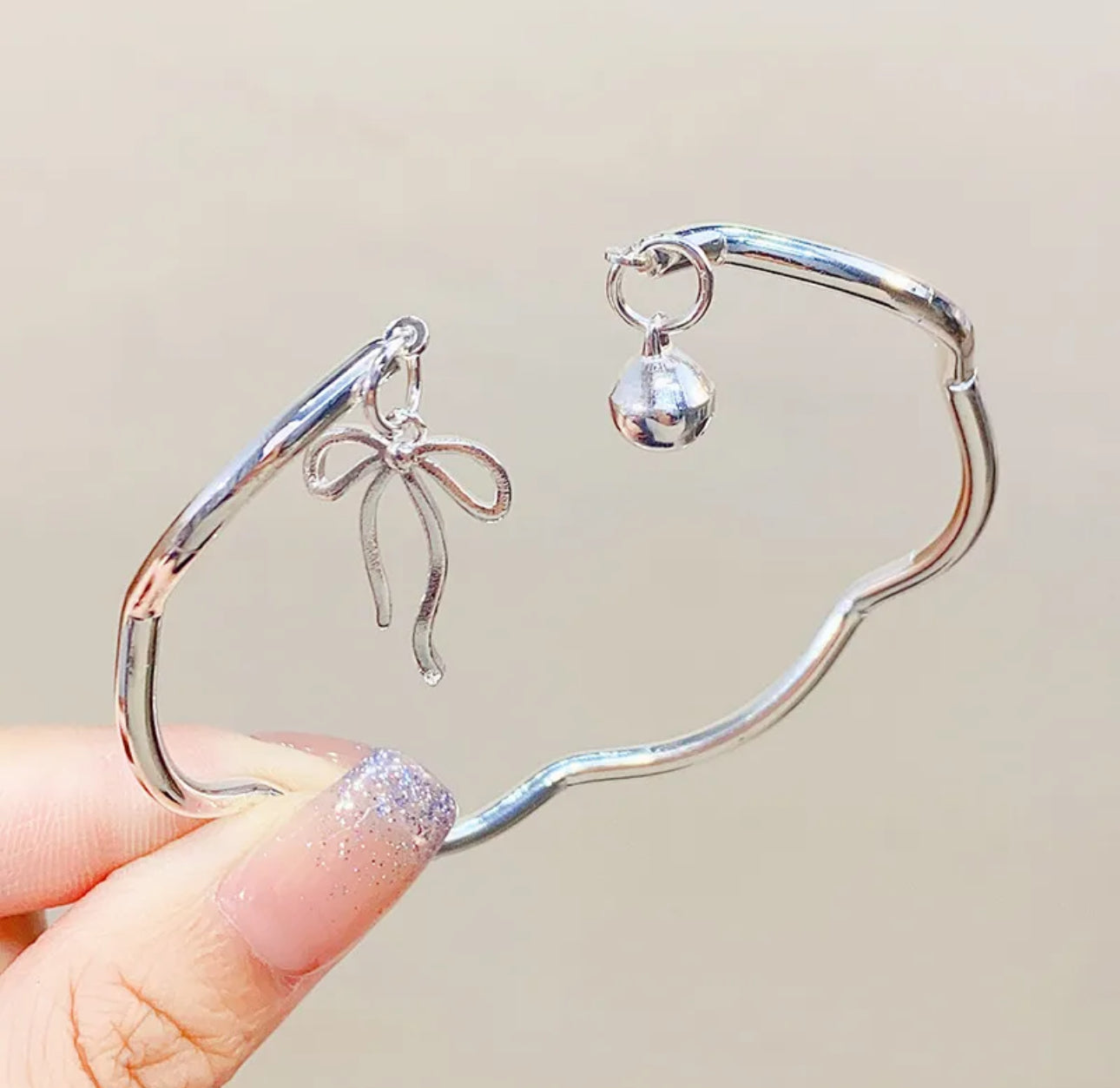 Minimalist Silver Bow Bracelet with Bell Charm
