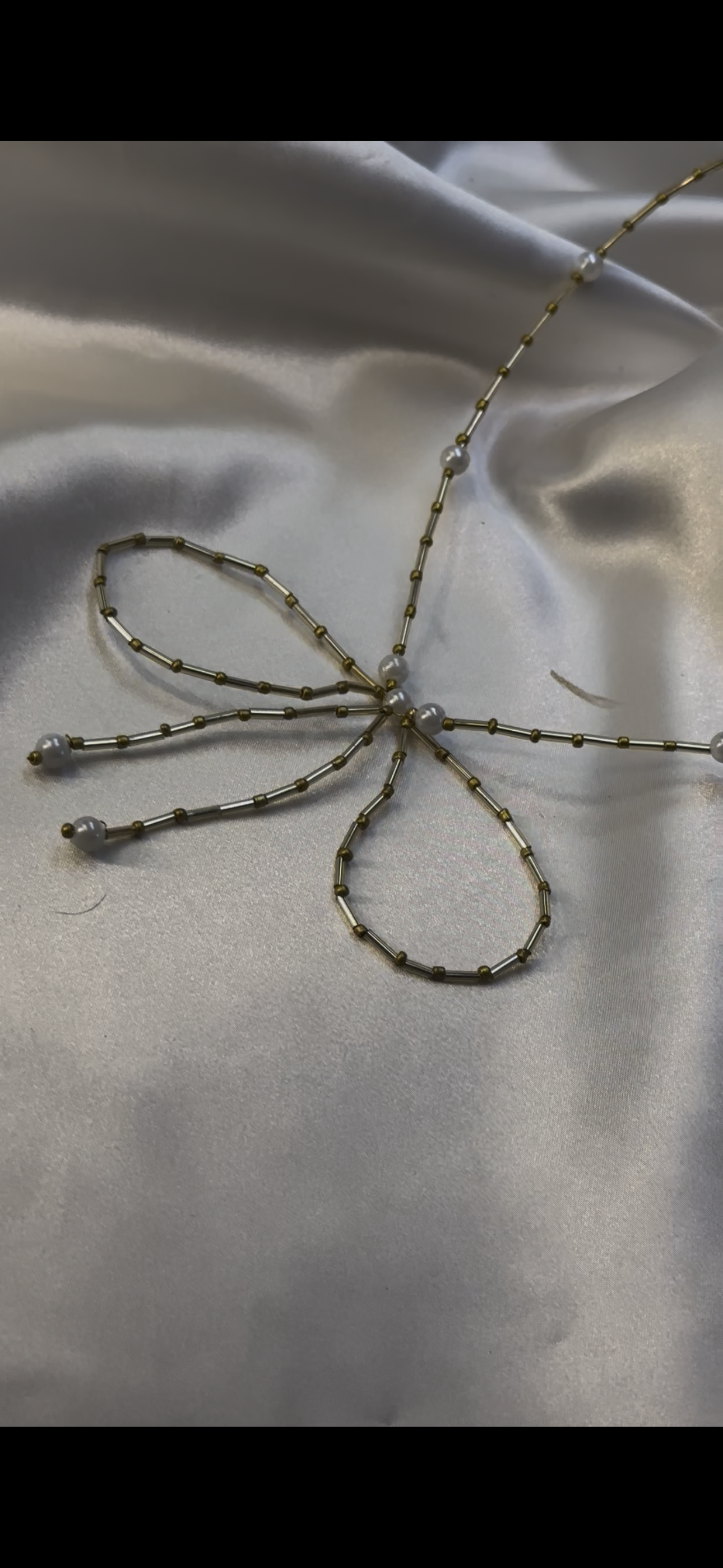 Gold beaded bow